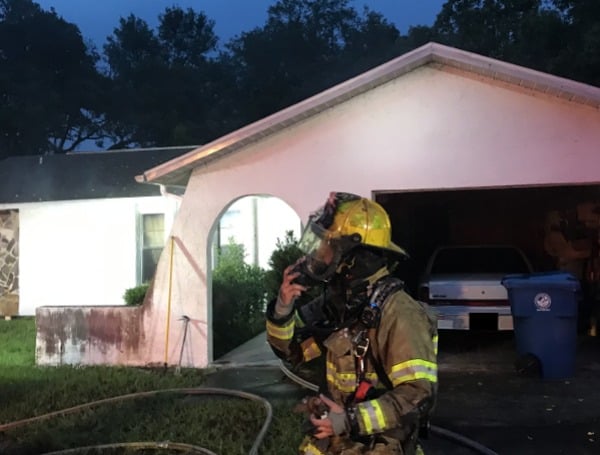 Hernando County Fire Personnel Rescue Person From A House Fire Monday