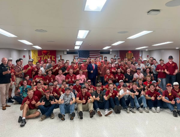 Trump Stumps In Iowa, Tossing Footballs, Flipping Burgers With Students On Game Day