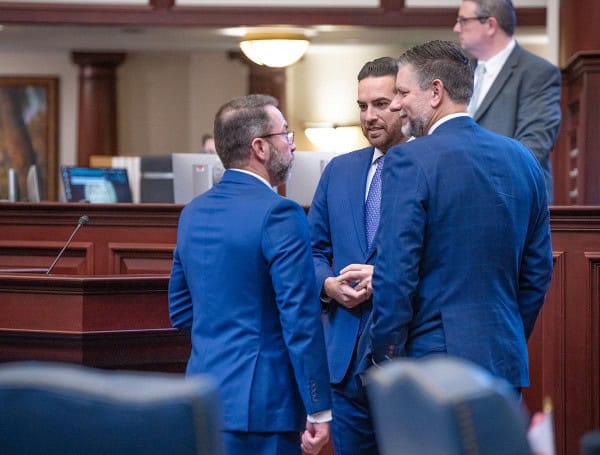 Florida Lawmakers Advance "Rainy Day" Fund Constitutional Amendment 1 Speaker Daniel Perez, R-Miami, confers with Rep. Sam Garrison, R-Fleming Island, and Rep. Jason Shoaf, R-Port St. Joe, in the House chamber. April 3, 2025
by Meredith Geddings